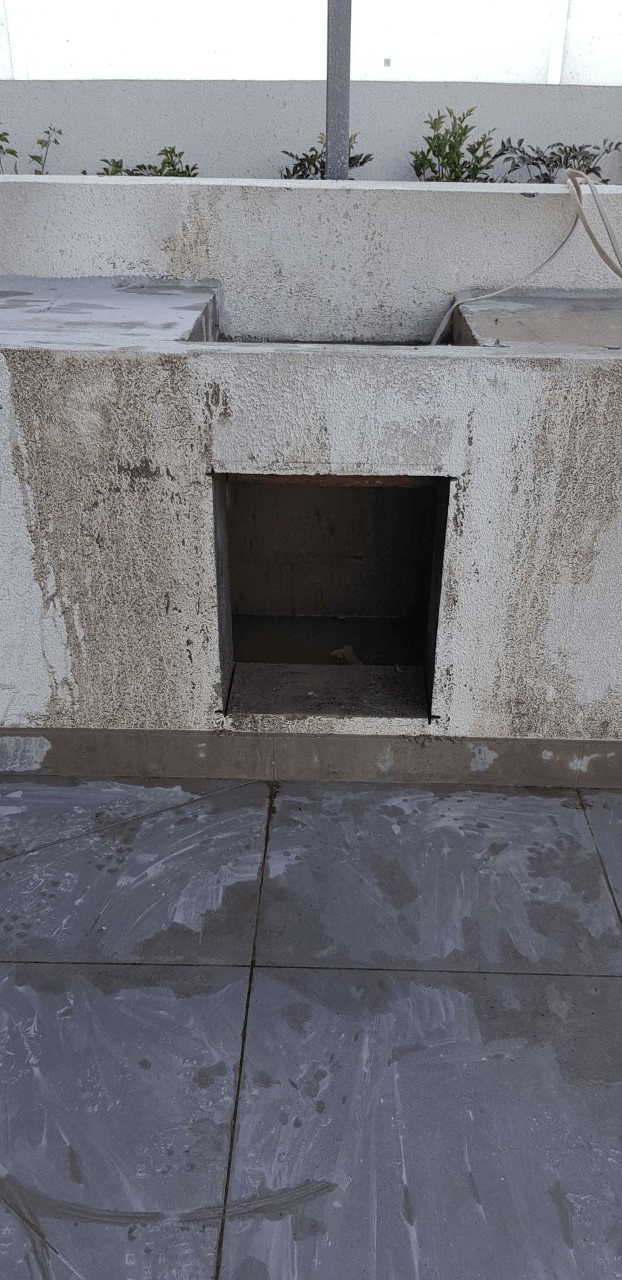 square hole cut in a concrete wall