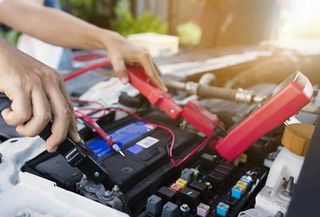Battery Service — Mechanic Checking the Car Battery in Laredo, TX