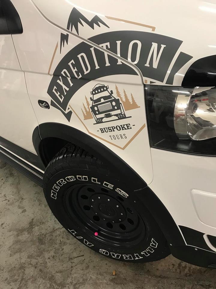 expedition stickers on a white van
