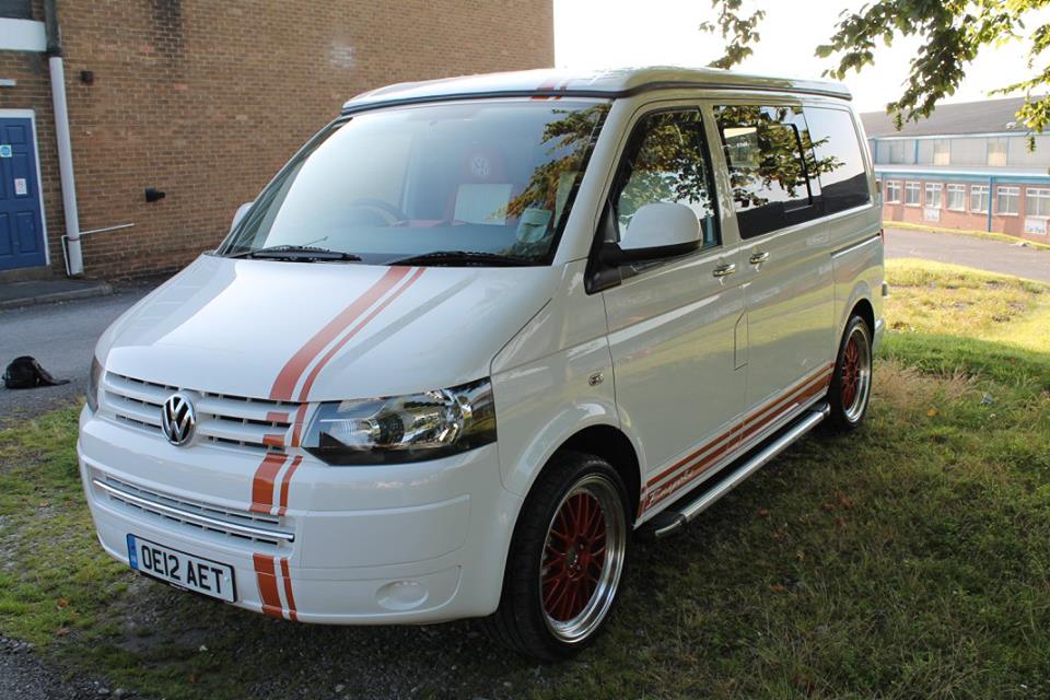 brown stripes running up and over a white van
