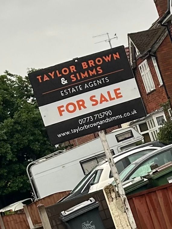 printed signs by a roadside advertising office space