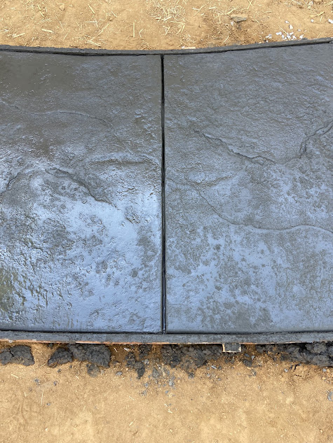 A close up of a concrete slab on the ground.