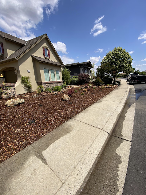 A house with a sidewalk in front of it