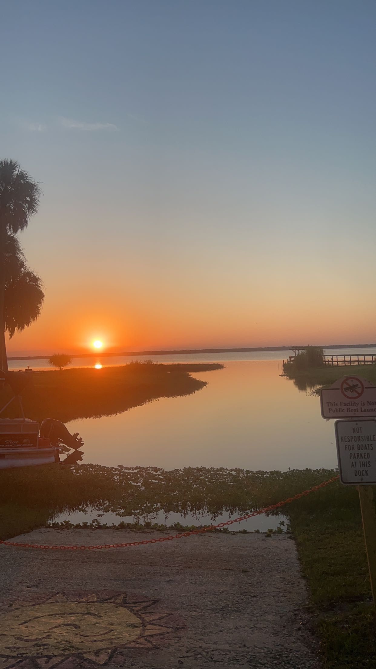 The sun is setting over a body of water.