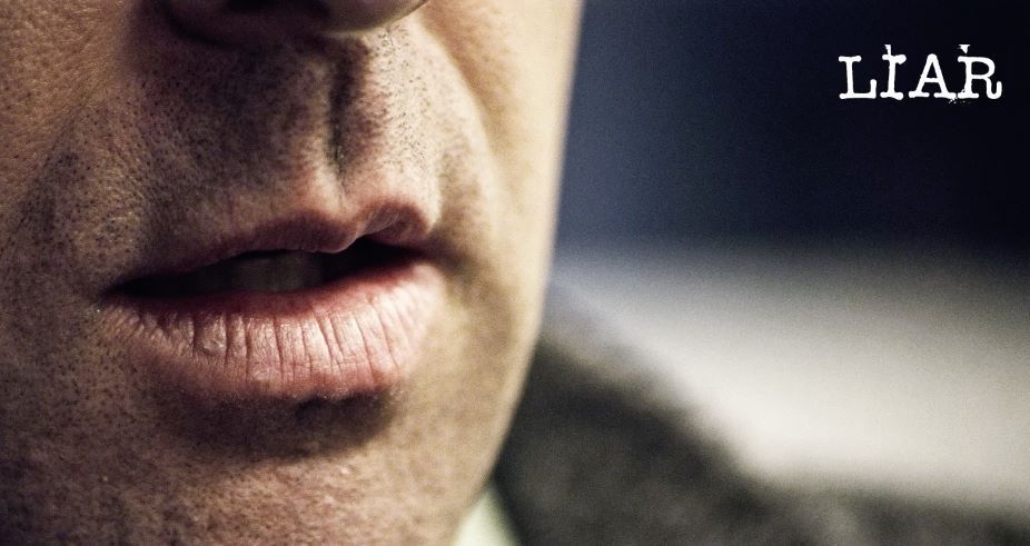 A close up of a man 's face with his mouth open.