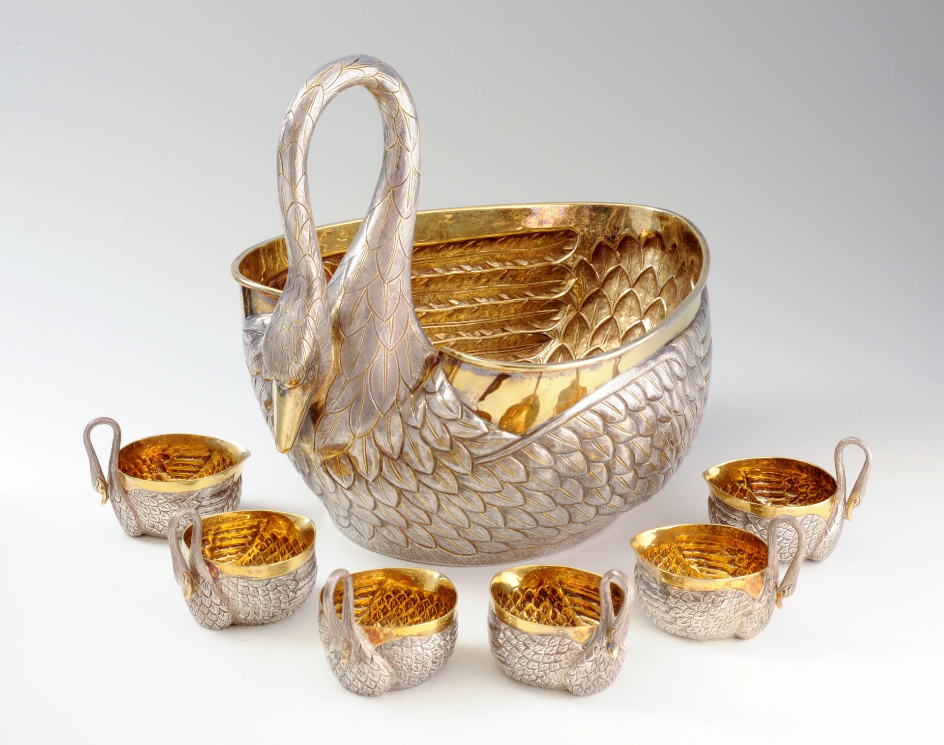 Quastel Associates | Silver swan-shaped bowl and six cups; the interiors are gilded. 