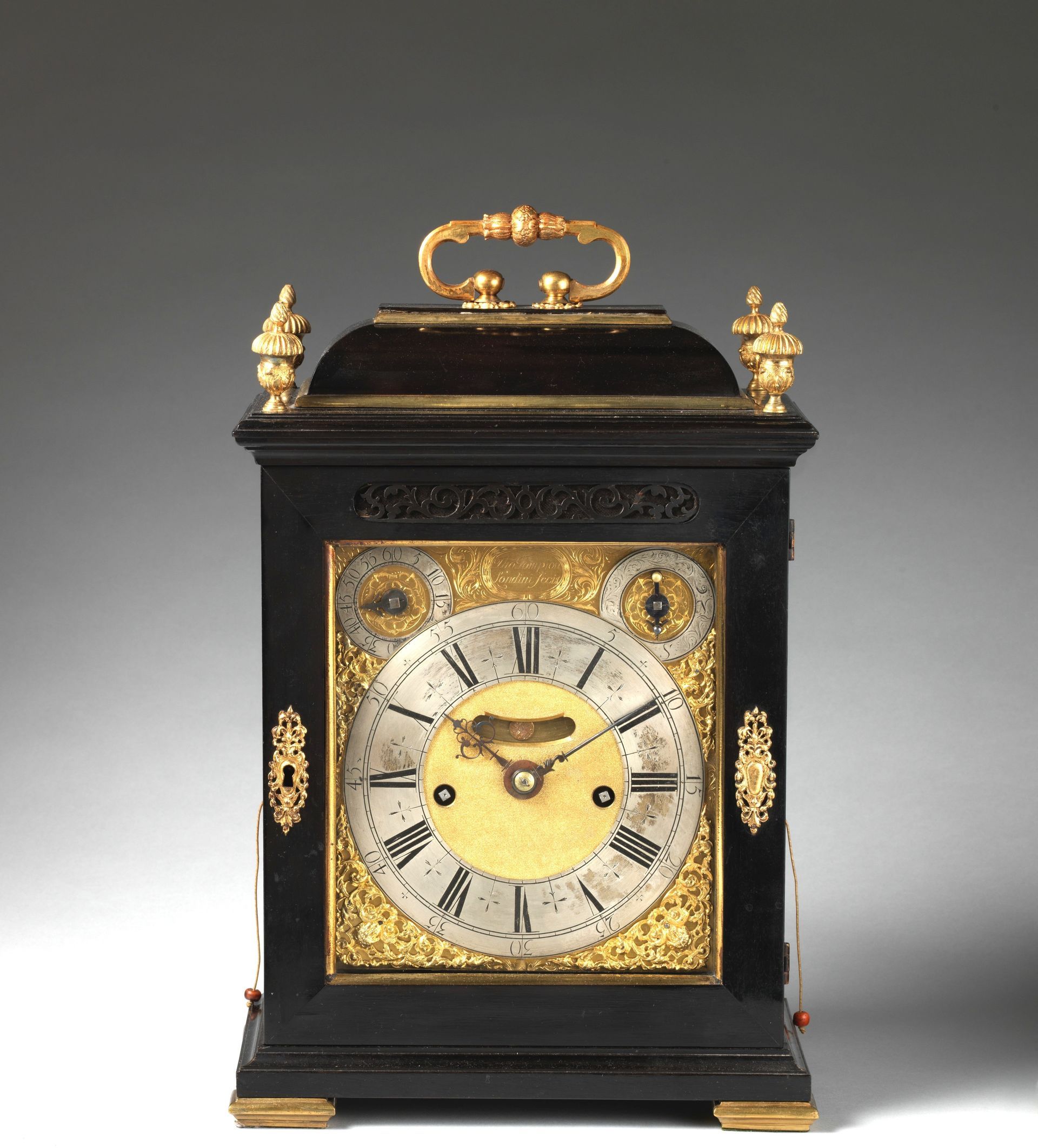 Quastel Associates Valuers | Antique black and gold clock with a decorative gold face and handle.