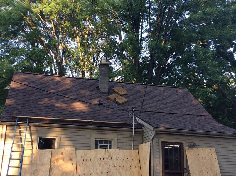 a house with a fence and trees.