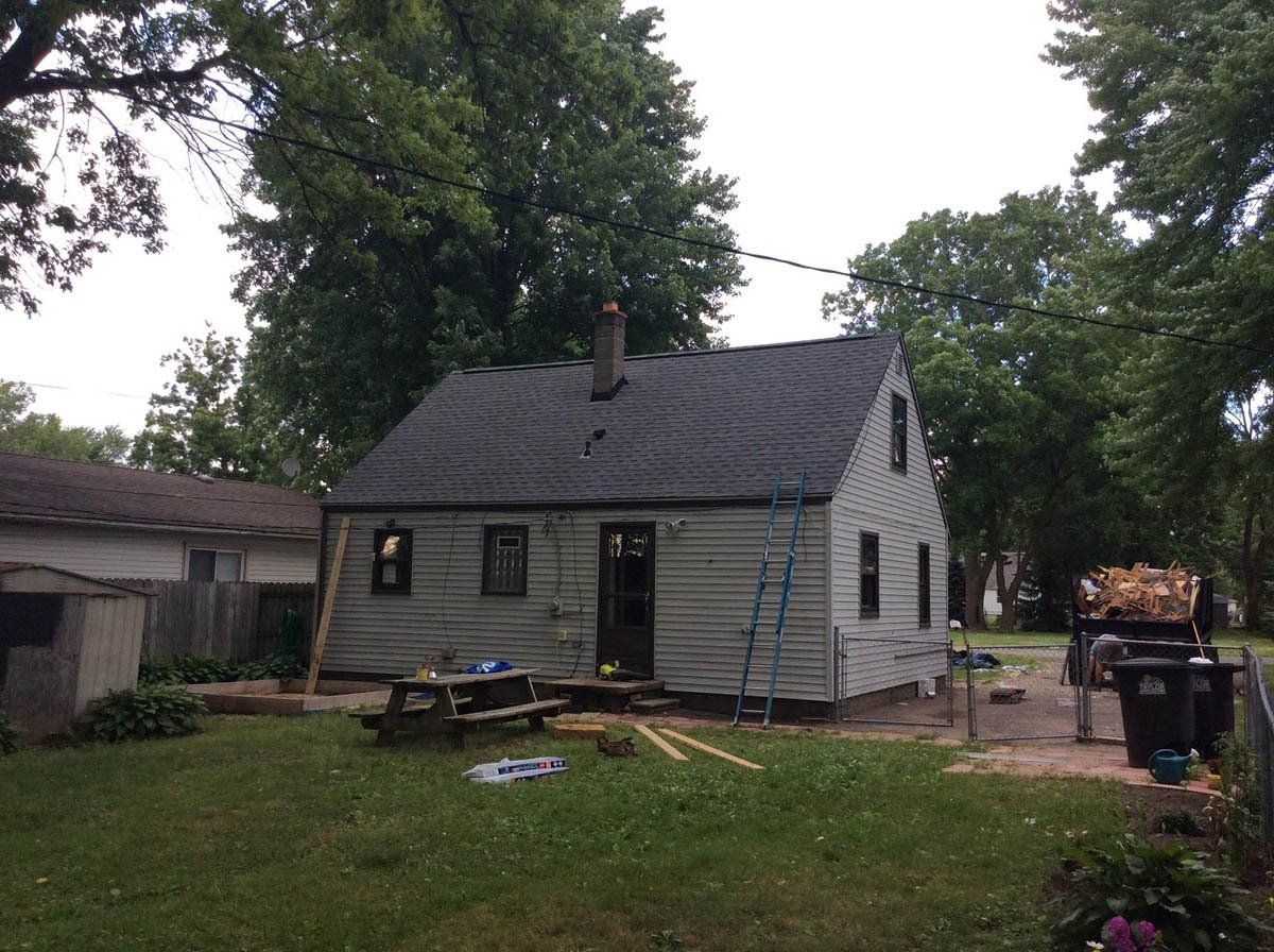 a house with a yard and trees.