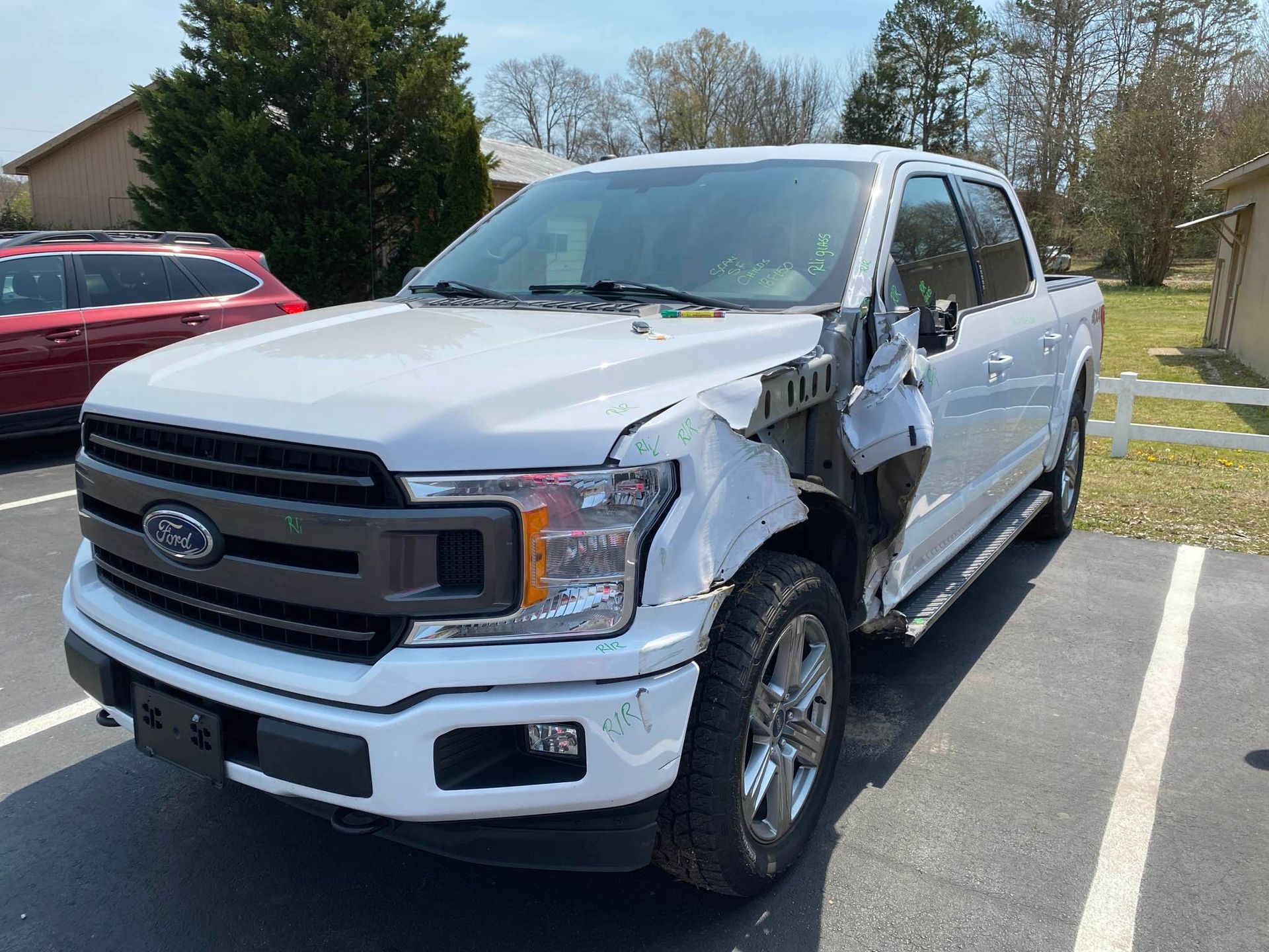 White Ford Truck parked in our parking lot | Windham Bodyshop