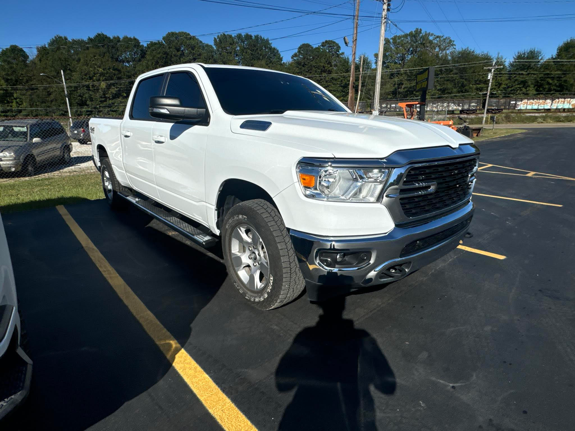 A white ram 1500 truck is parked in a parking lot.  | Windham Bodyshop