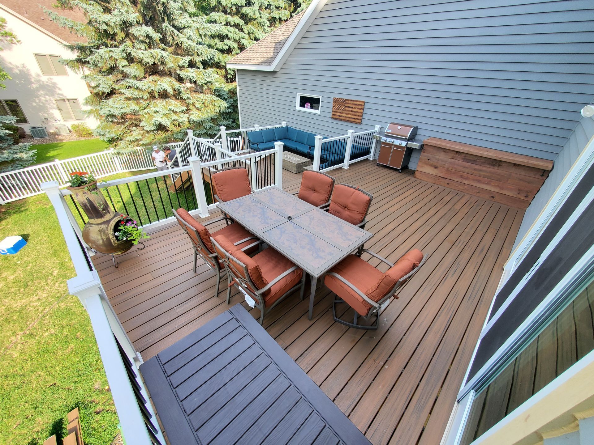 An aerial view of a deck with a table and chairs.