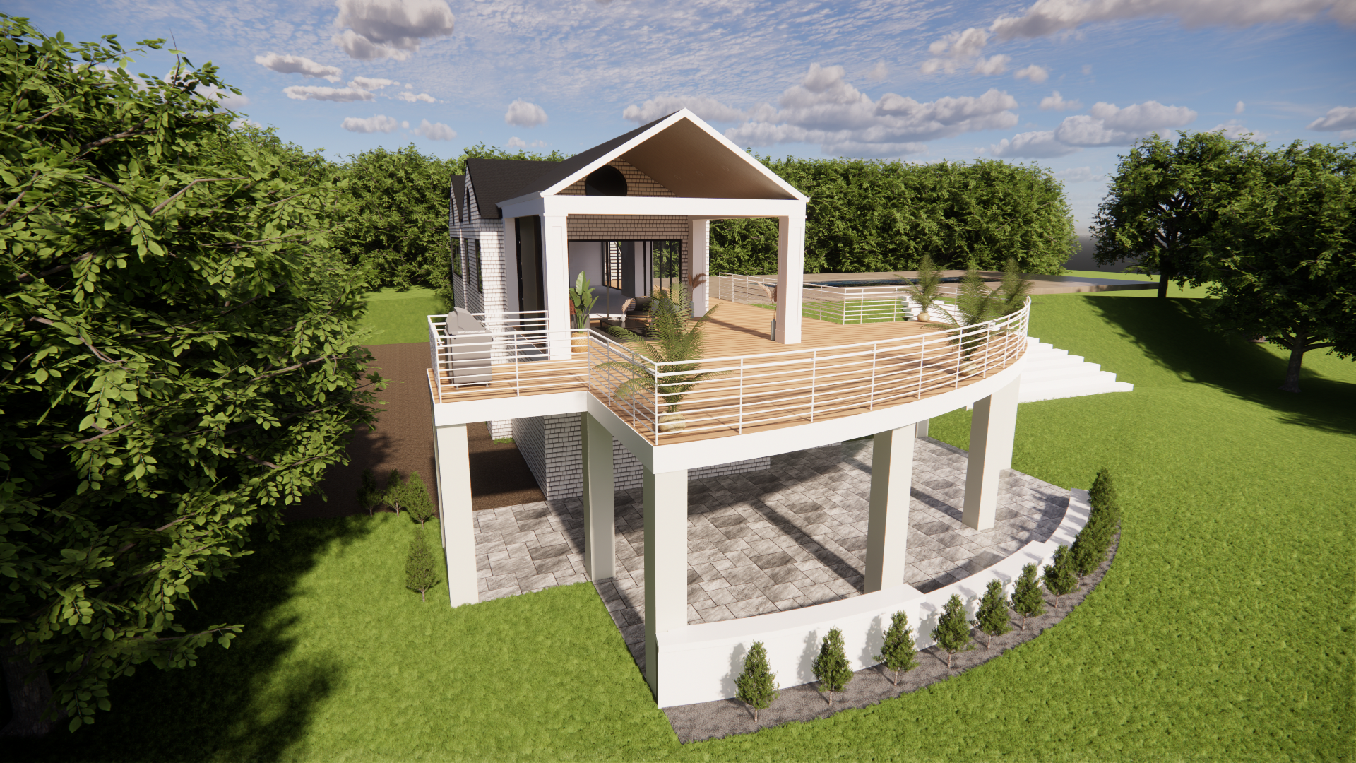 An aerial view of a house with a large deck surrounded by trees.