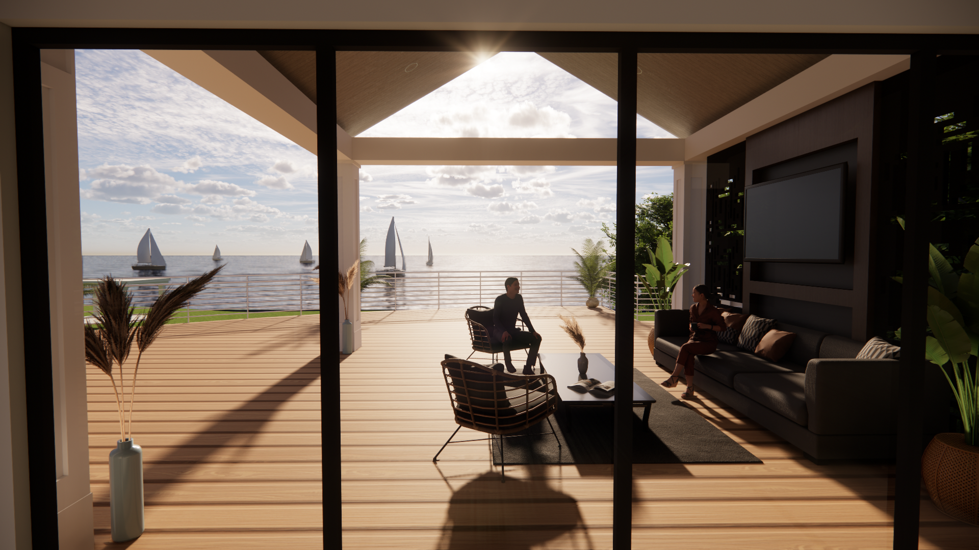 A man is sitting on a couch in a living room with a view of the ocean.