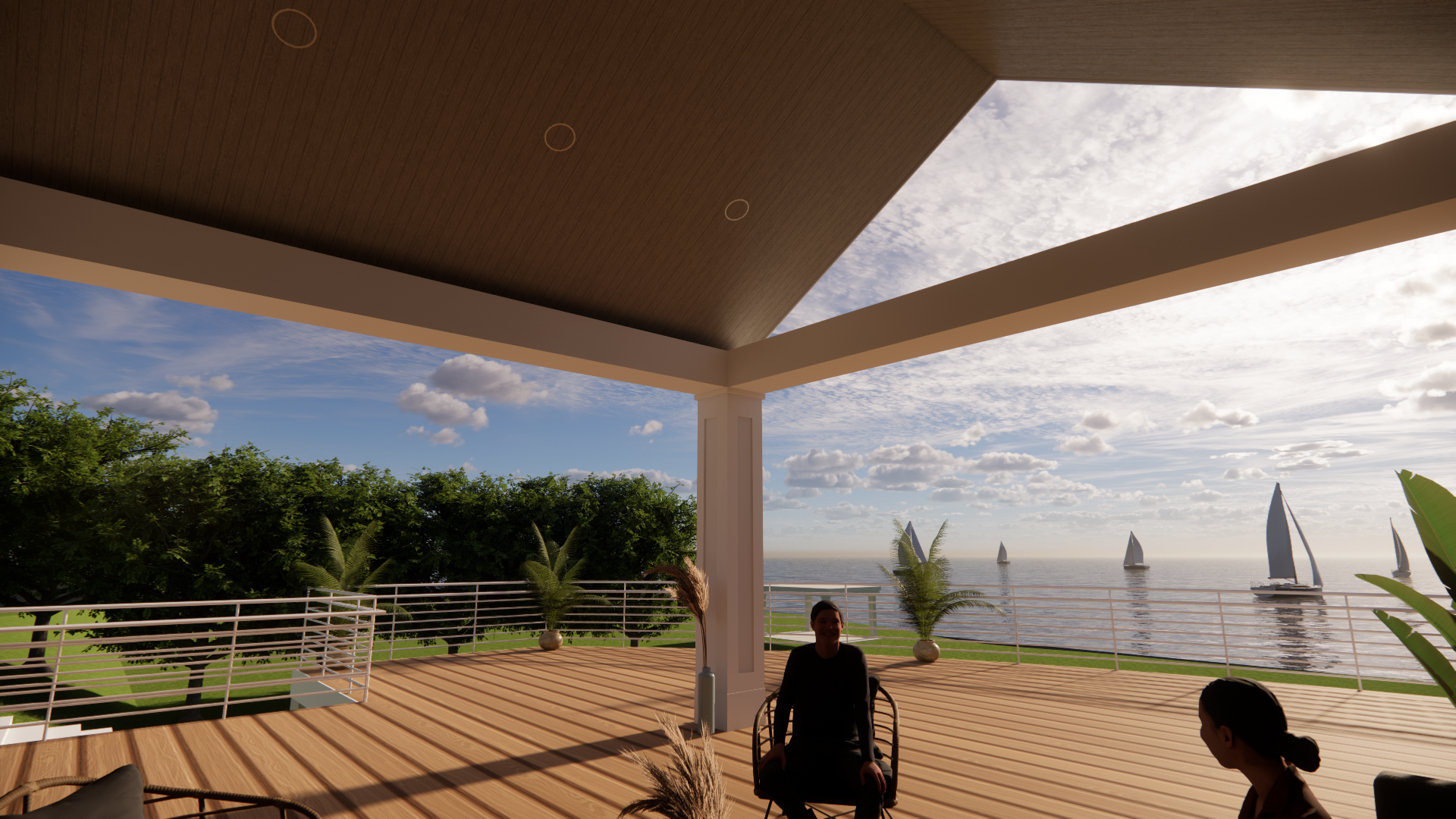 A man in a wheelchair is sitting on a patio overlooking the ocean.
