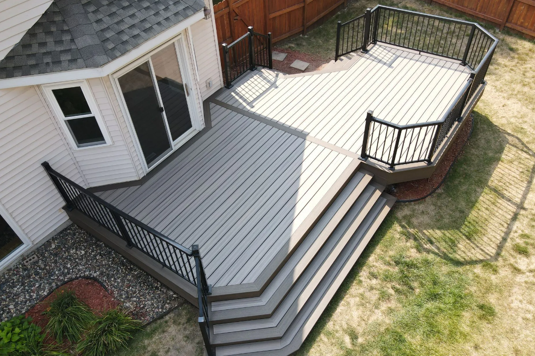 An aerial view of a large wooden deck with stairs leading up to it.