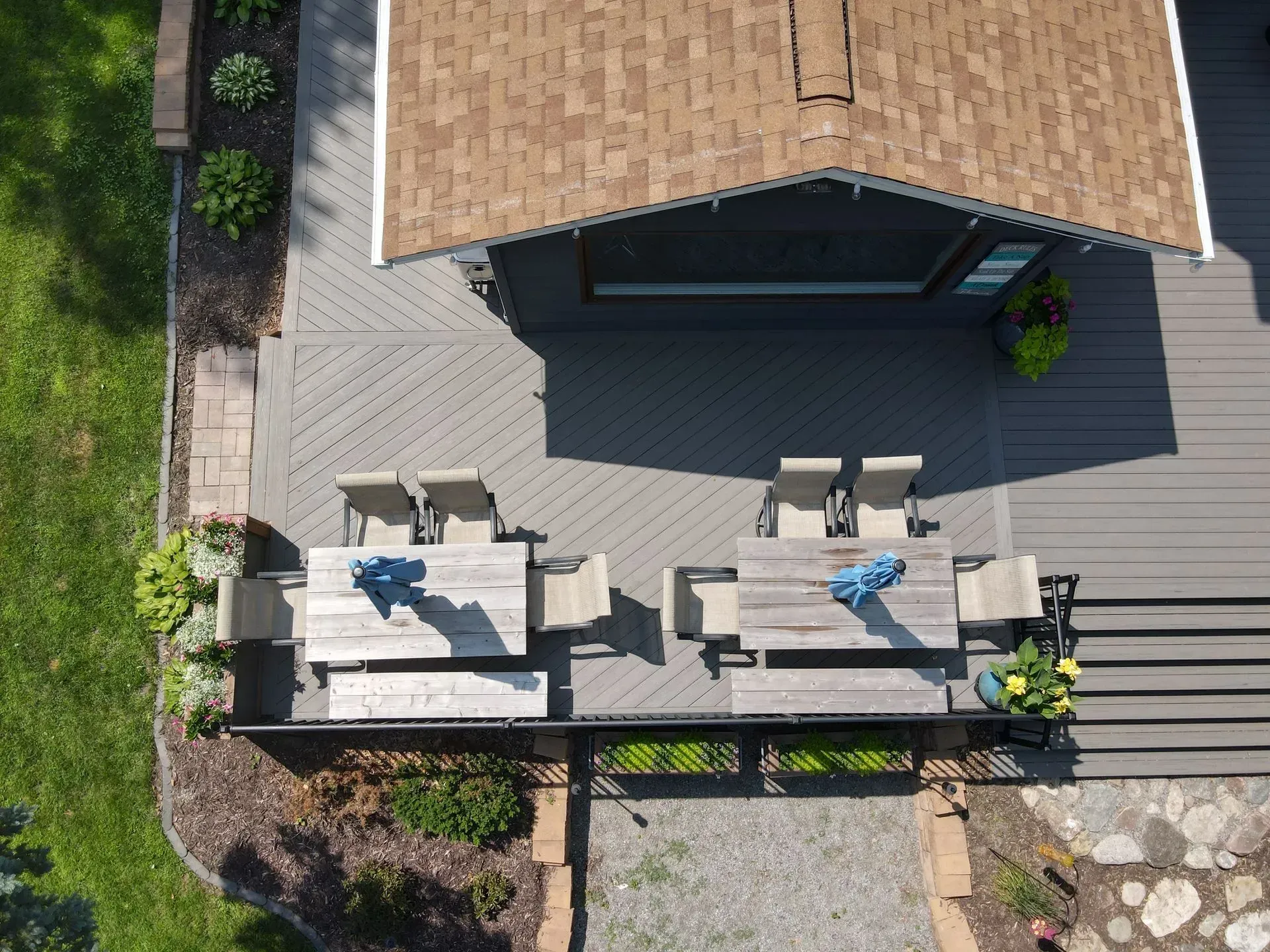 An aerial view of a deck with a table and chairs.