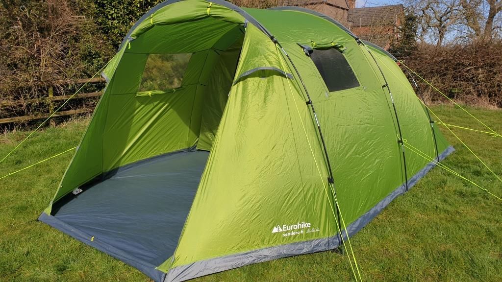 Eurohike Sendero 4 spacious three-person tent, pre-pitched in a private campsite, featuring easy access.
