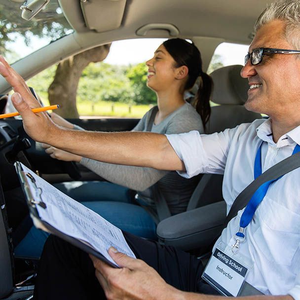 Driving Instructor Teaching a Student — Driving School in Townsville, QLD