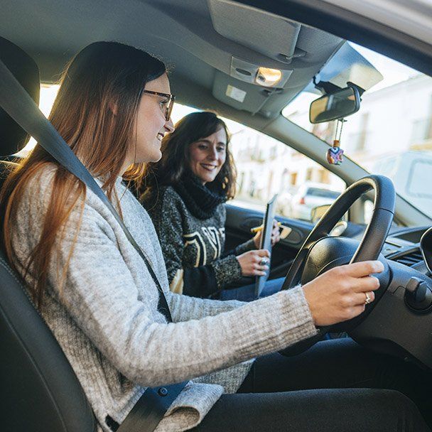 Women Driving the Car with Instructor — Driving School in Townsville, QLD
