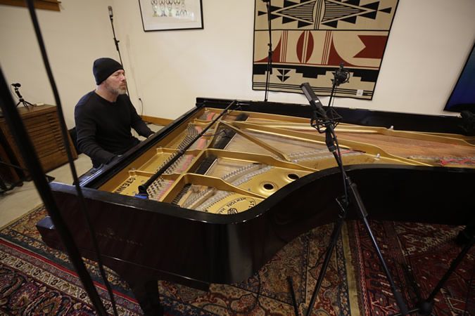 Michael Newhouse Allison playing piano during recording session for Where Hope Rises