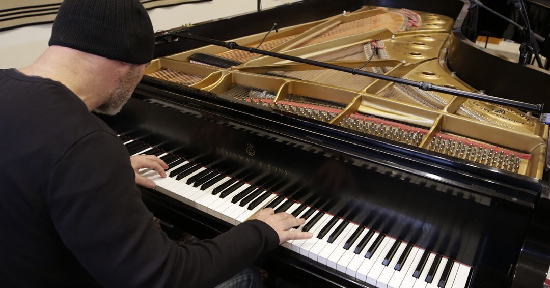 Michael Newhouse Allison playing piano during recording session for Where Hope Rises