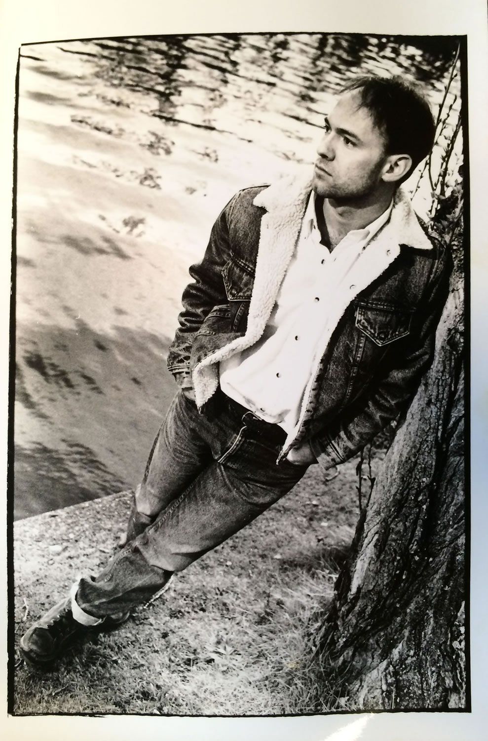 Michael Newhouse Allison r portrait 1990s - standing by water and tree.