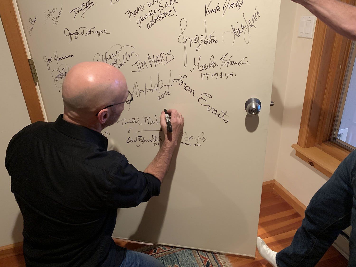 Michael Newhouse Allison signing studio door.