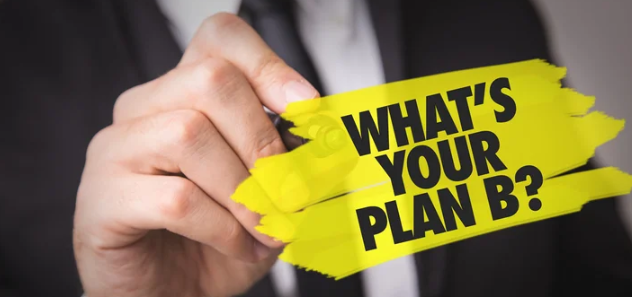 A person is holding a piece of yellow tape that says `` what 's your plan b ''.