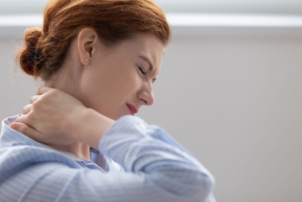 A Woman With Neck Pain — Chris Trevor & Associates in Gladstone Central, QLD