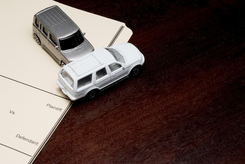 A White and Grey Toy Car On A Table — Chris Trevor & Associates in Gladstone Central, QLD