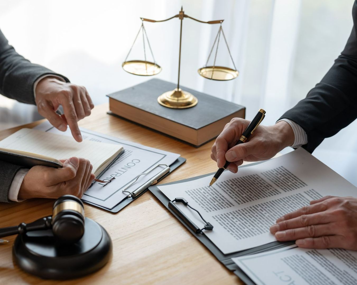 A Couple of People Are Sitting at a Table — Chris Trevor & Associates in Biloela, QLD