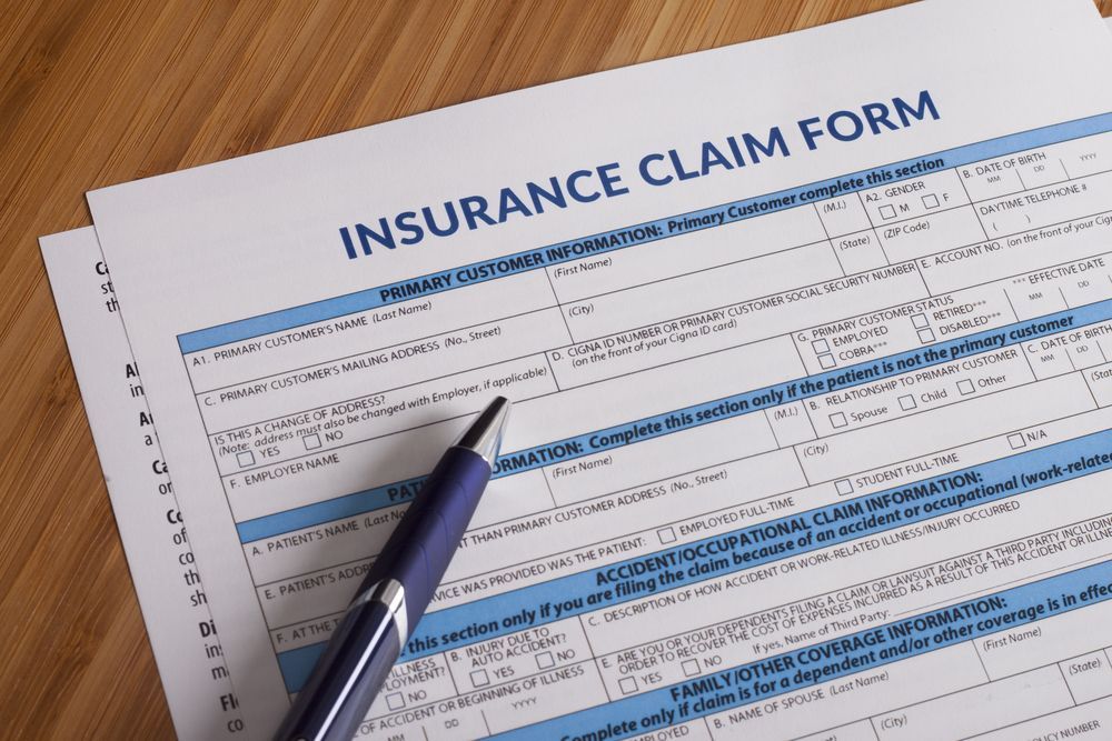 An Insurance Claim Form With a Pen on Top of It — Chris Trevor & Associates in Emerald, QLD