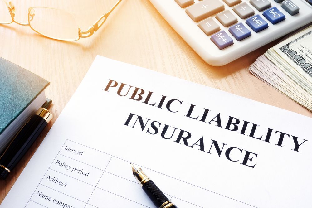 A Pen is Sitting on Top of a Paper That Says Public Liability Insurance — Chris Trevor & Associates in Clermont, QLD