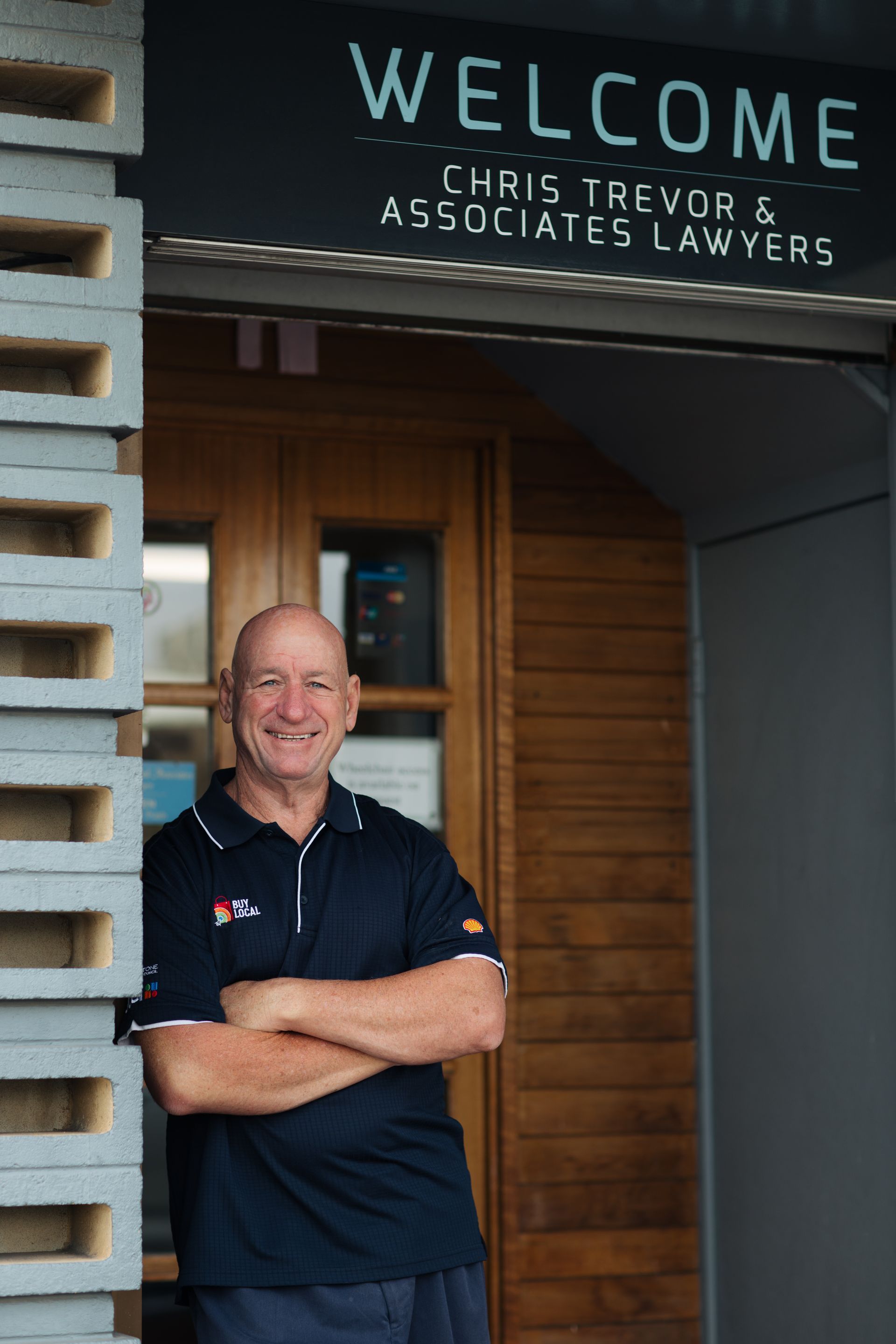 A Hard Hat, a Leve, and a Judge's Gavel Are on Top of Blueprints — Chris Trevor & Associates in Gladstone Central, QLD