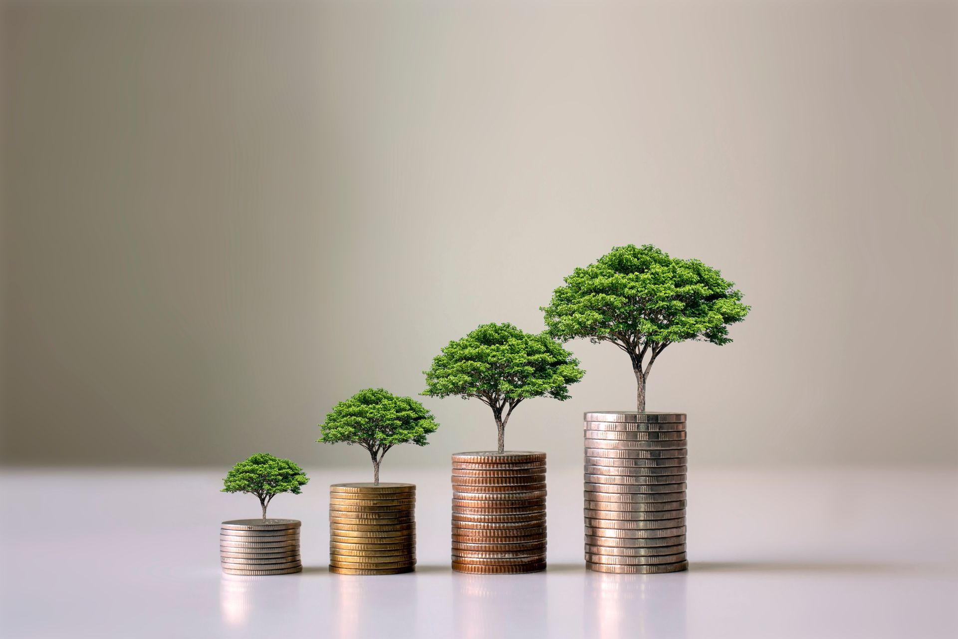 A stack of coins with trees growing out of them.