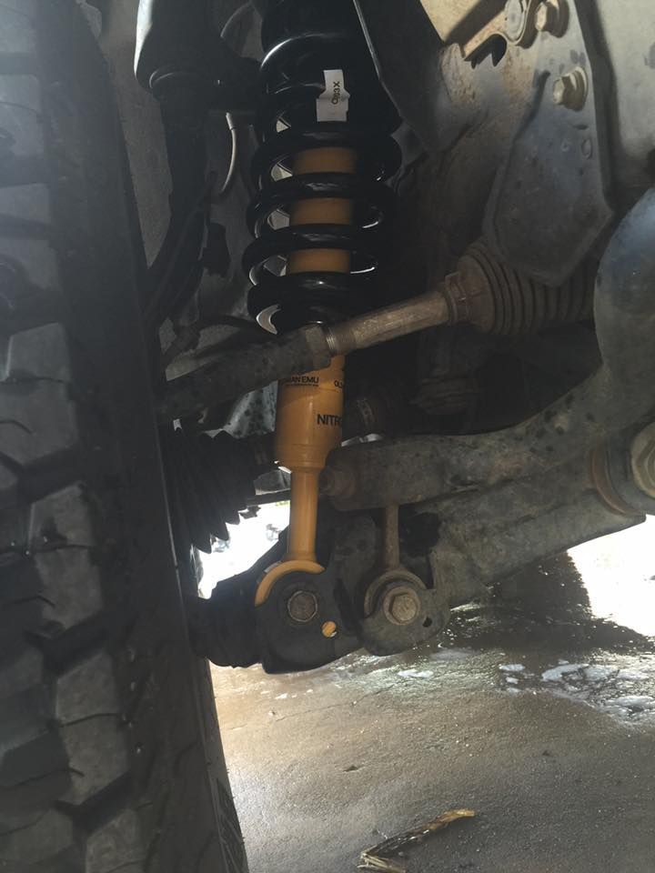 A Close Up of a Shock Absorber on a Car — Emerald 4x4 in Emerald, QLD