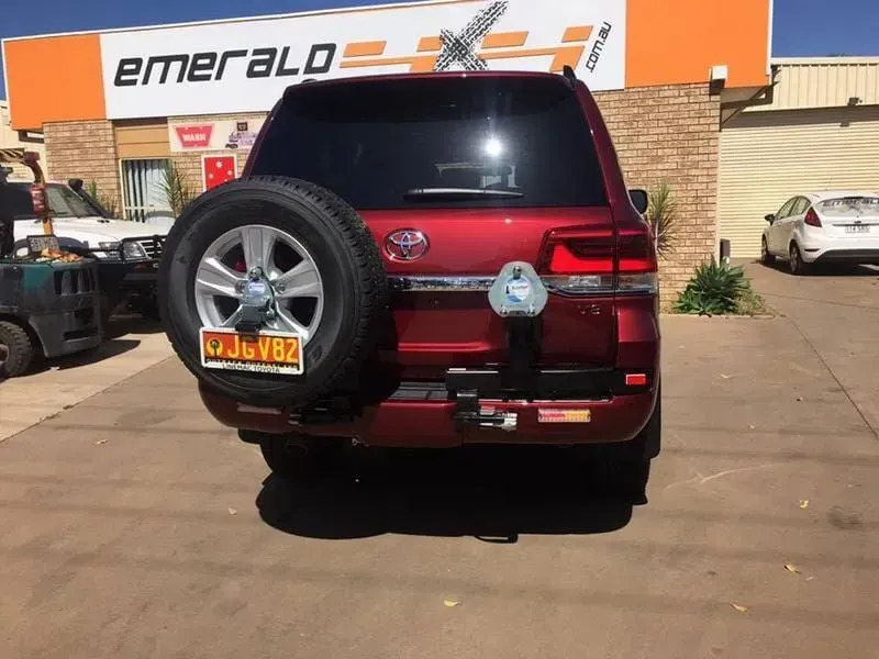 A Red Suv is Parked in Front of a Building That Says Emerald — Emerald 4x4 in Emerald, QLD