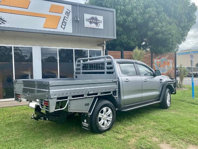 A Pickup Truck With a Flat Bed is Parked in Front of a Building — Emerald 4x4 in Emerald, QLD