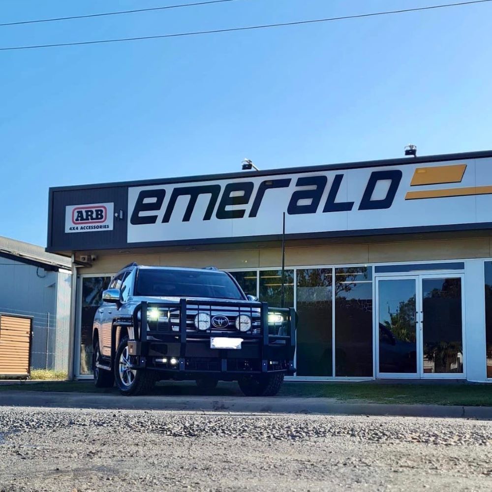 A Car is Parked in Front of a Building That Says Emerald — Emerald 4x4 in Emerald, QLD