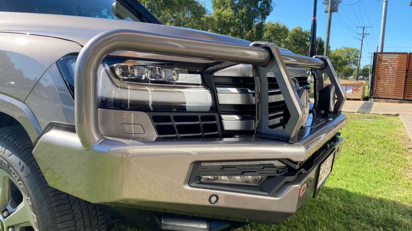 A Close Up of a Car 's Front Bumper on a Lush Green Field — Emerald 4x4 in Emerald, QLD