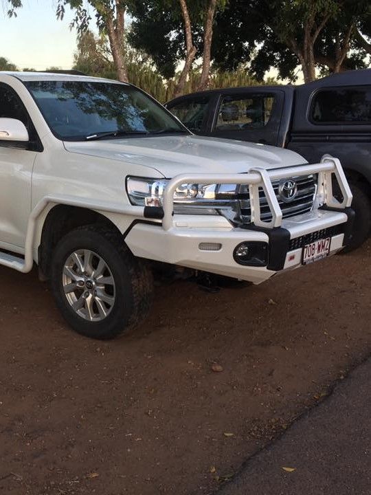 Two White Trucks Are Parked Next to Each Other on the Side of the Road — Emerald 4x4 in Emerald, QLD