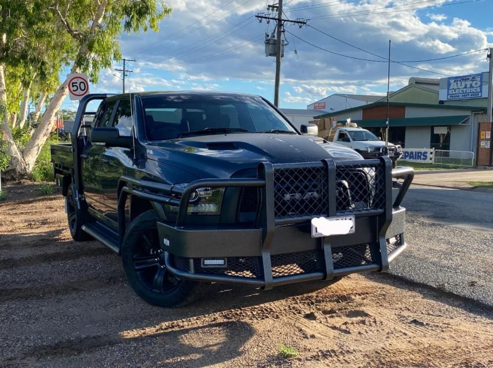 A Black Truck is Parked on the Side of the Road — Emerald 4x4 in Emerald, QLD