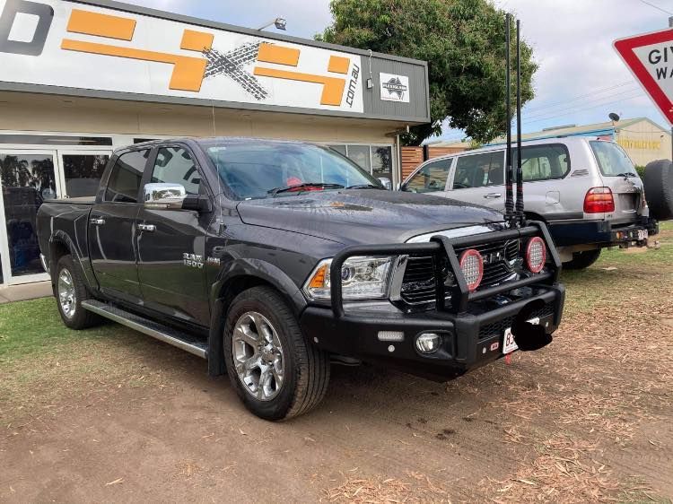 A Black Truck is Parked in Front of a Car Dealership — Emerald 4x4 in Emerald, QLD