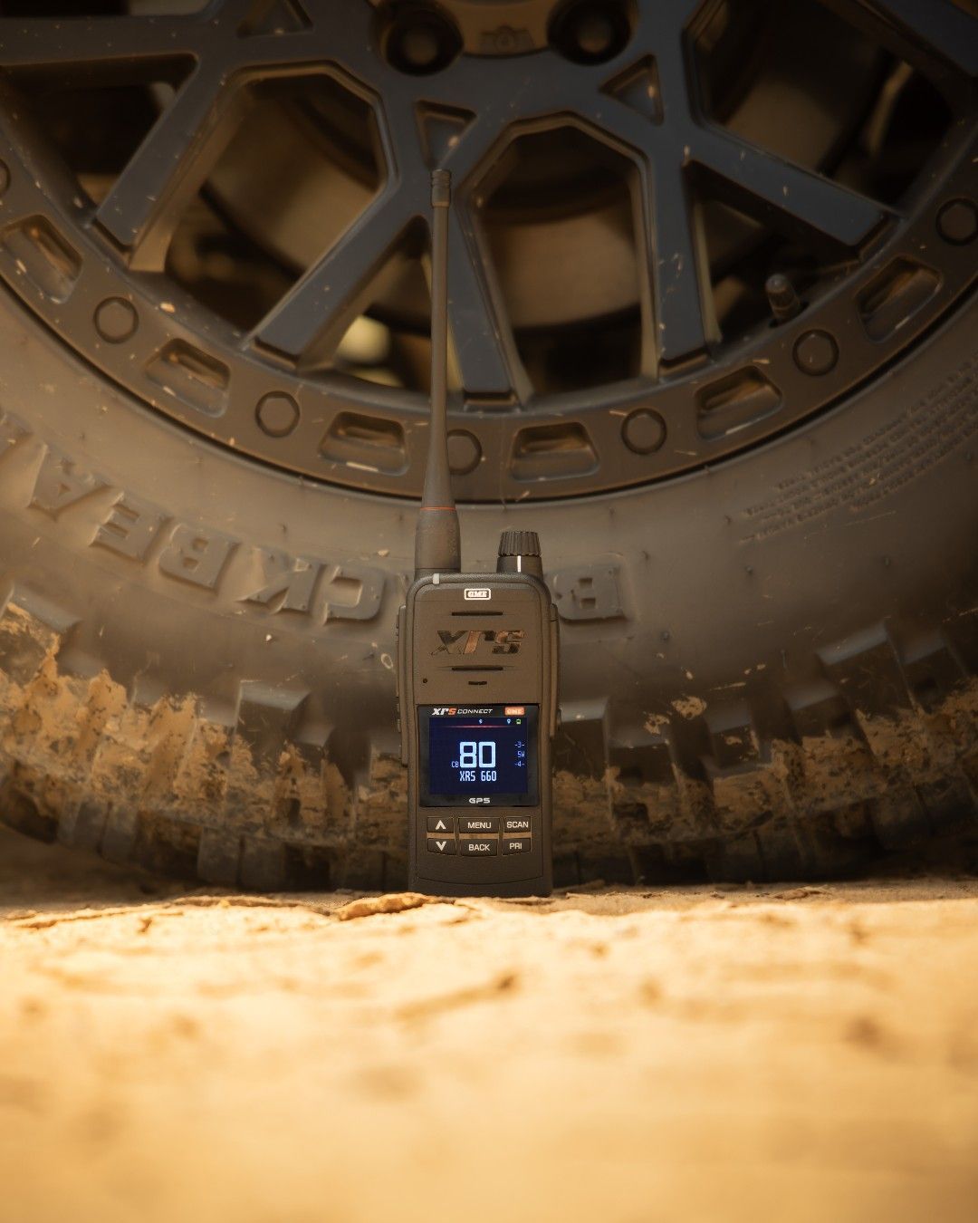 A Walkie Talkie is Sitting Next to a Tire on the Ground — Emerald 4x4 in Emerald, QLD