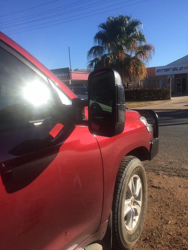 A Red Truck is Parked on the Side of the Road — Emerald 4x4 in Emerald, QLD