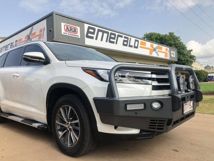 A White Suv is Parked in Front of a Building That Says Emerald — Emerald 4x4 in Emerald, QLD