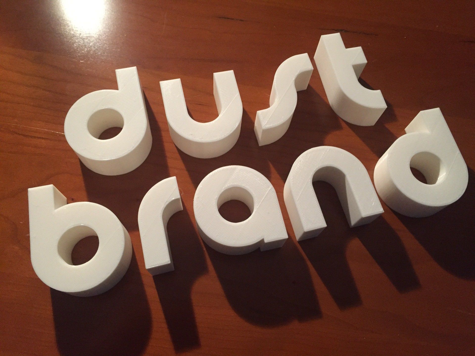 3d prints of the words dust brand