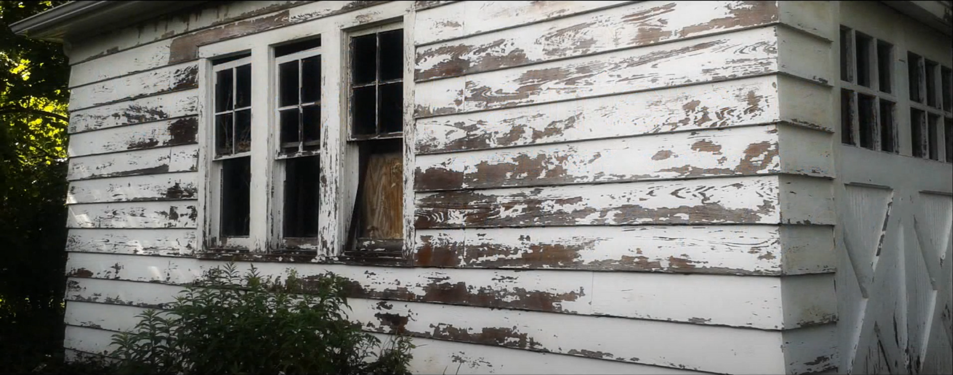 picture of exterior of home that is weathered