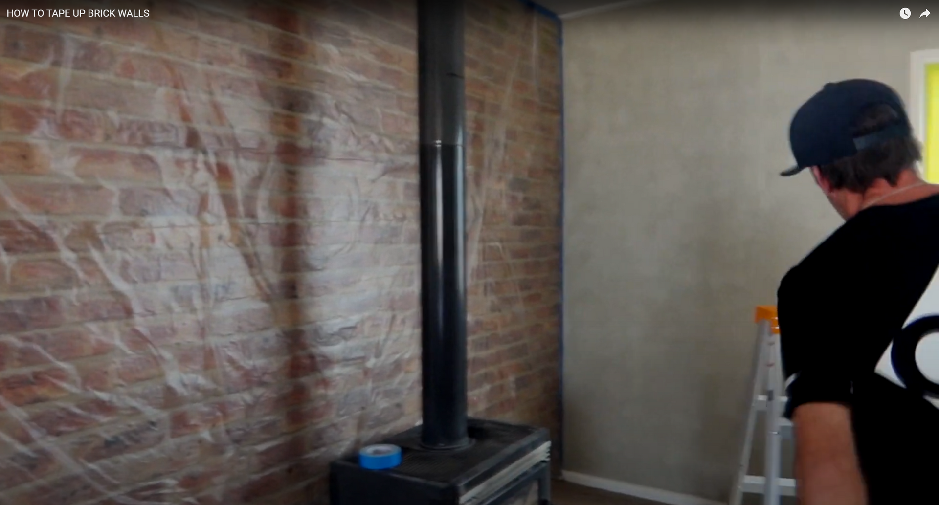 picture of interior of house with a brick wall covered